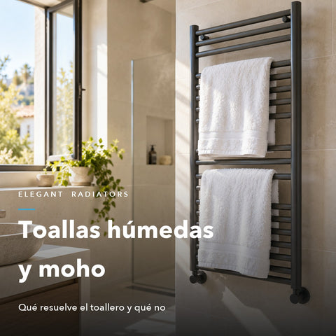 Dos toallas blancas extendidas secándose en un toallero antracita junto a una ventana abierta en un baño luminoso